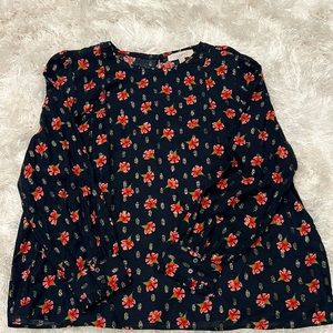 This is a beautiful loft blouse. Black with red and orange floral detail.
